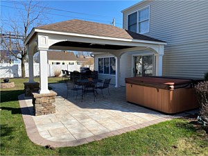 boral southern ledgestone bucks county cultured stone outdoor kitchen bbq area with bar seating chesapeake alpine brick pavers brown border pedestal columns under gazebo